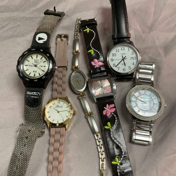 Tray of assorted wristwatches, fashion and vintage timepieces.