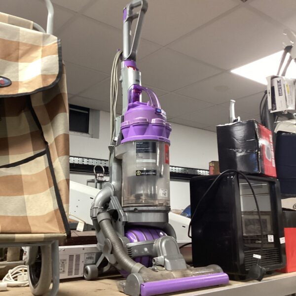 Used Dyson DC14 upright vacuum cleaner for home cleaning.