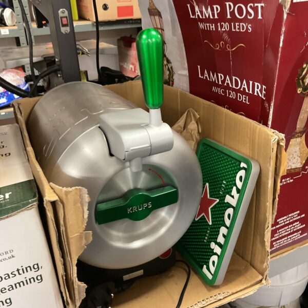 Front view of a used Krups Heineken beer pump.