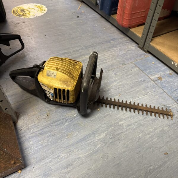 Vintage McCulloch petrol hedgecutter for garden maintenance.