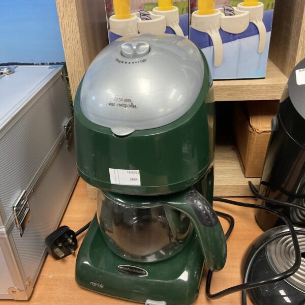 Close-up of a vintage Morphy Richards coffee machine in used condition.