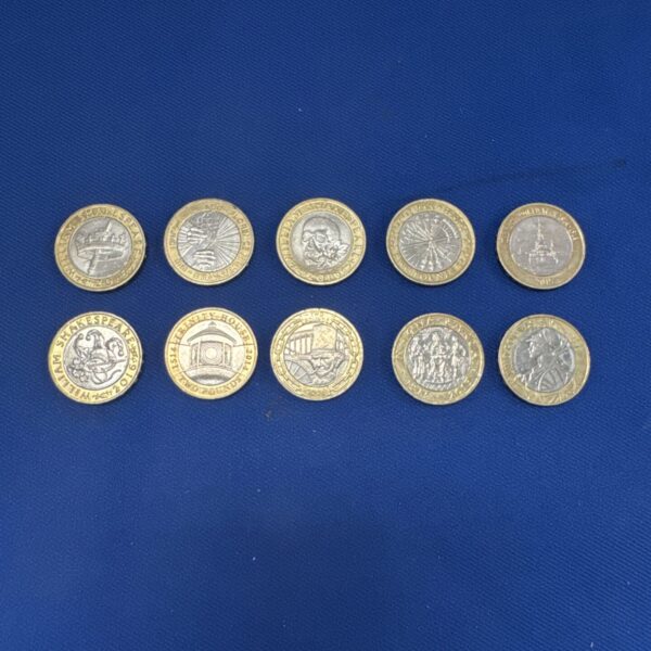 Selection of UK £2 coins including a William Shakespeare commemorative coin.