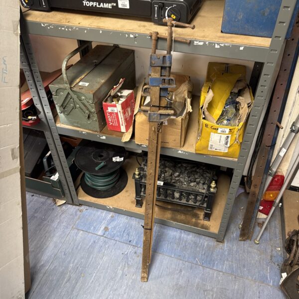 Pair of vintage metal sash clamps for woodworking projects.