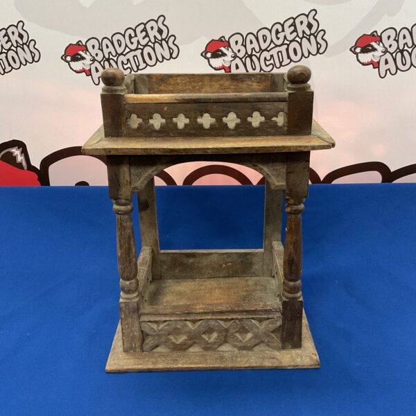 Antique Persian hardwood shrine with intricate carvings.
