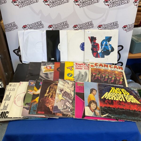 Vintage vinyl record collection including Bay City Rollers LP.