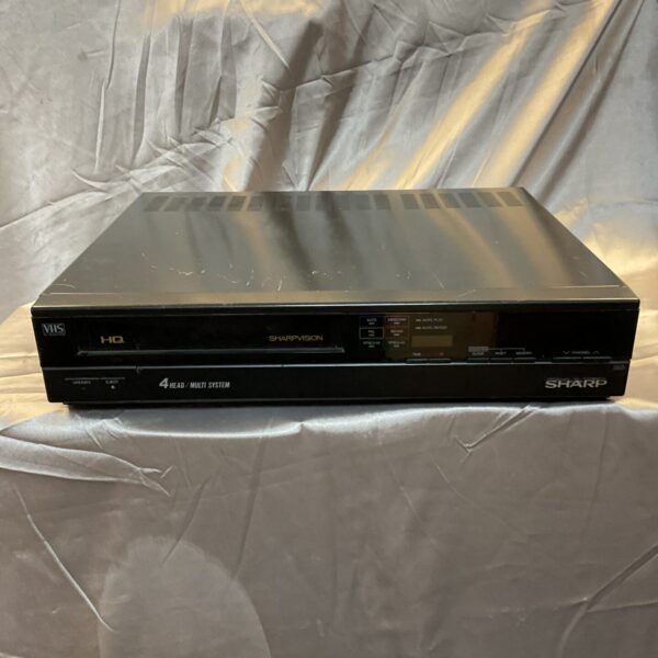 Vintage Sharp 4 head Vhs Recorder for analog video playback.