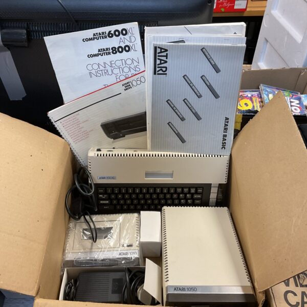 Vintage Atari 800XL computer with cassette and disc drive.