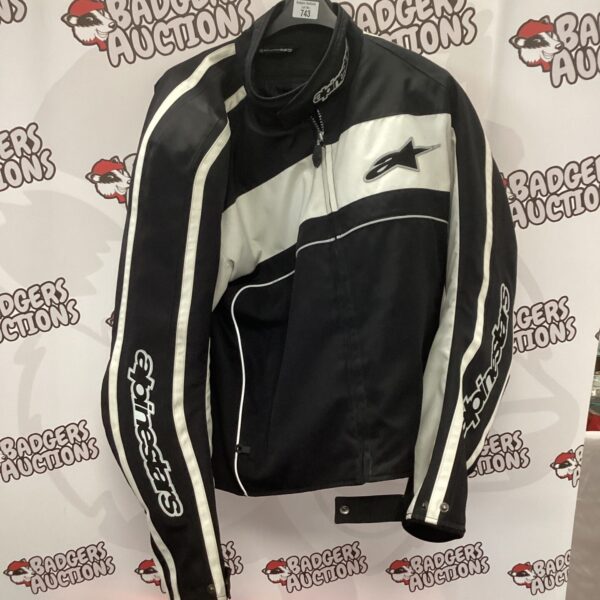 Alpinestars XXL motorcycle jacket, black and white racing design.
