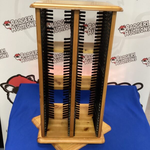 Pine floor standing DVD rack for media storage.