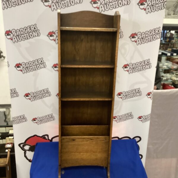 Vintage oak shelving unit with four shelves for display.