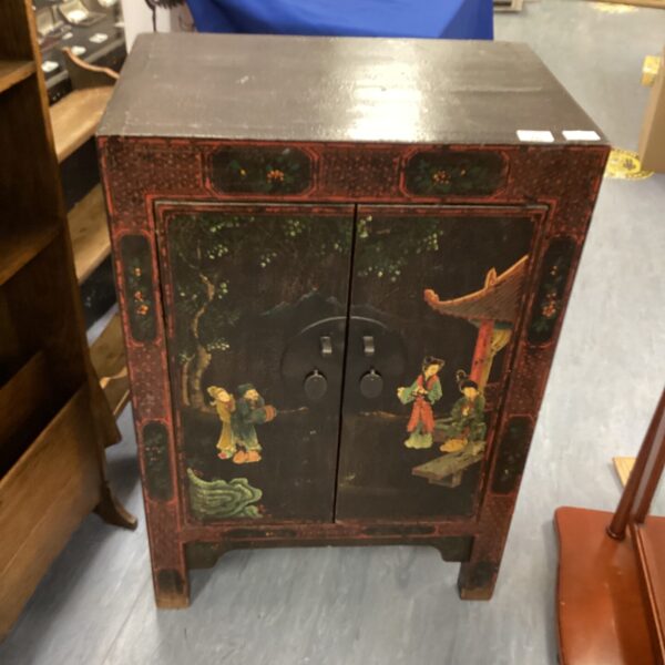 Front view of a darkwood Japanese design cabinet.