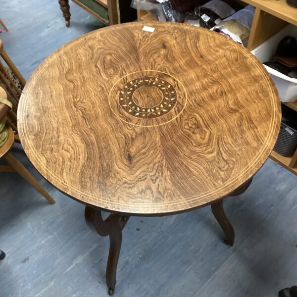 Antique oak hall table with inlaid wood detailing.