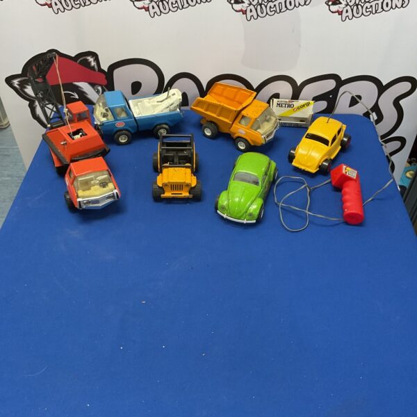 Vintage Tonka diecast trucks and cars in a collectible lot.