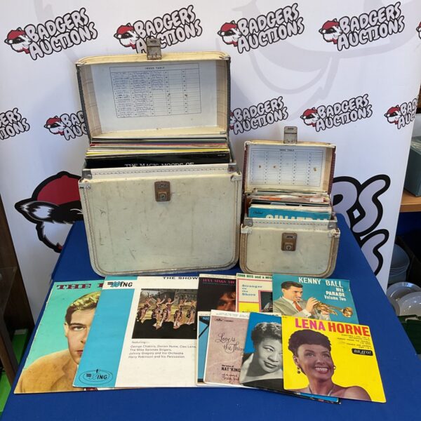 Mixed lot of vintage vinyl records, including 12” and 7” formats.