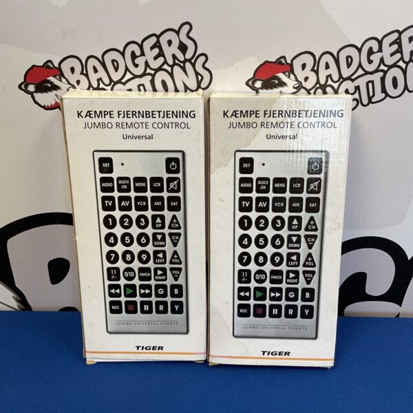 Two vintage jumbo remote controls for televisions, retro design.