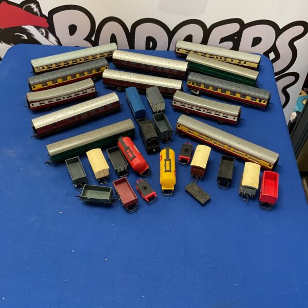 Vintage Hornby rolling stock lot with colourful carriages and railway vehicles.