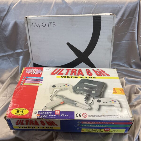 Vintage 8bit console with Sky Q 1TB box for retro gaming.
