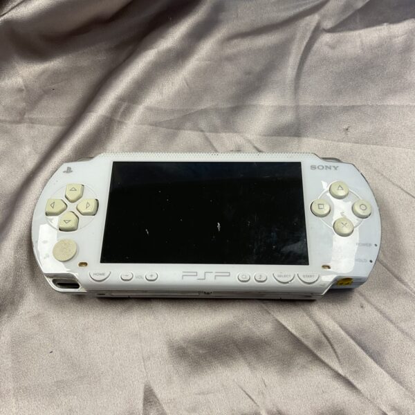 White Sony PSP-3000 handheld console for retro gaming.