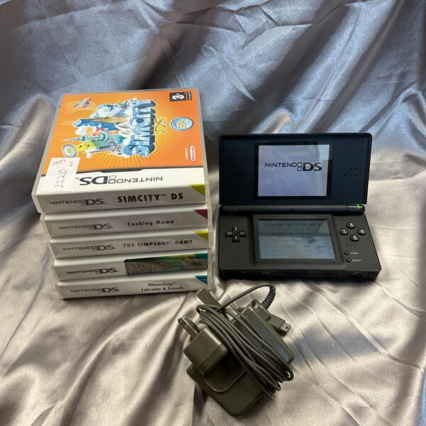 Black Nintendo DS Lite console with games and charger.