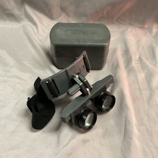 Vintage Russian B-12 head-mounted binoculars with case.