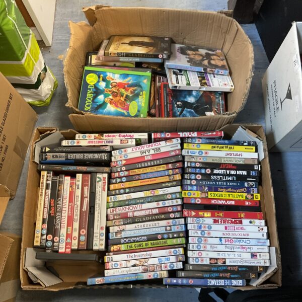 DVD movie lot featuring Scooby Doo and family films.
