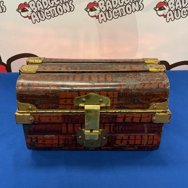 Vintage tin treasure chest with embossed details.