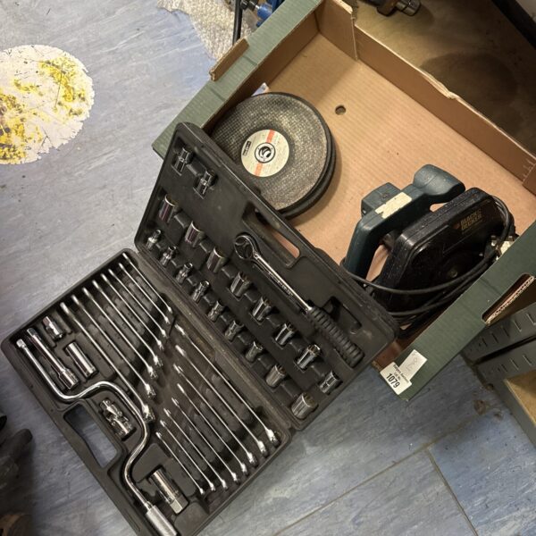 Socket and spanner tool kit with circular saw and disc blades.