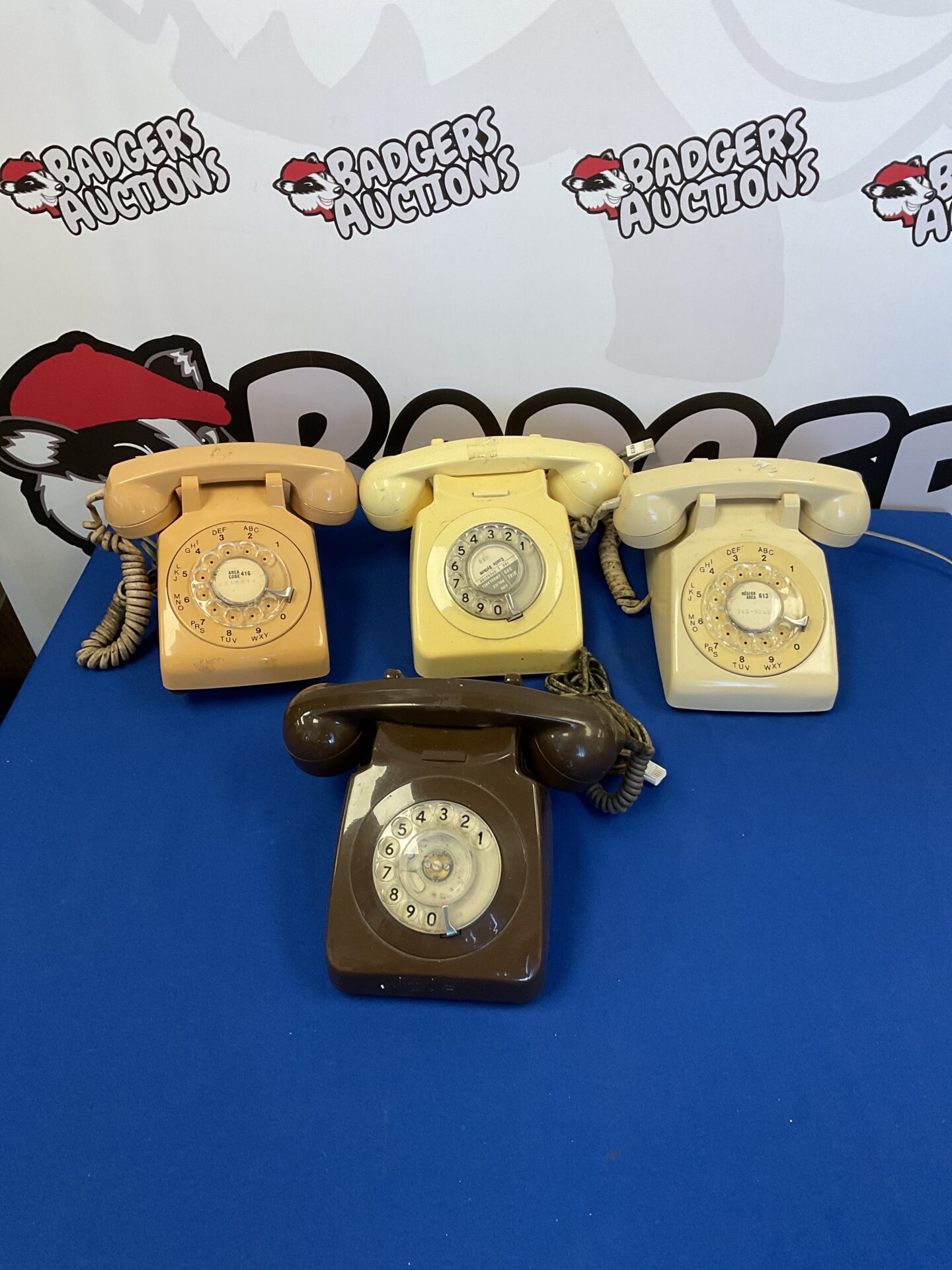 216 Four vintage rotary telephones