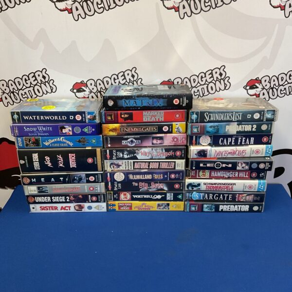 Vintage VHS movie cassette collection with Bruce Lee films.