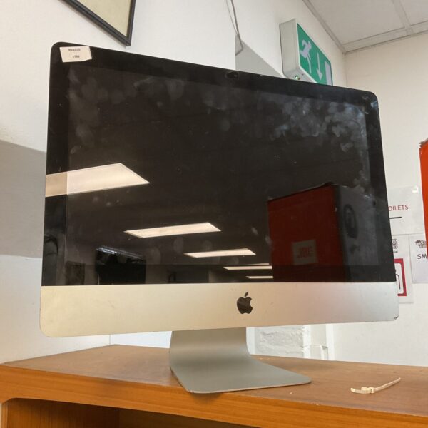 Vintage Apple iMac 2428 computer with a sleek design.