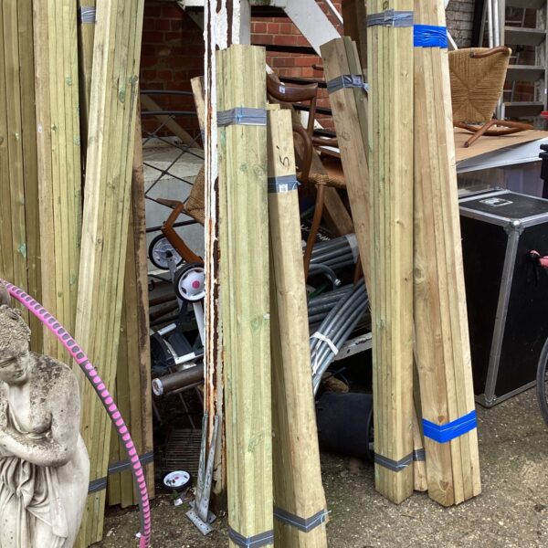 Strapped bundles of timber ready for construction or DIY projects.