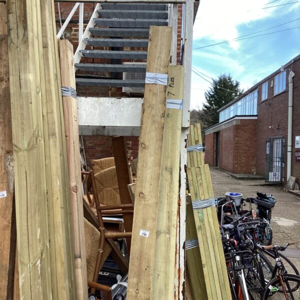 Stacked timber bundles ready for construction or DIY projects.