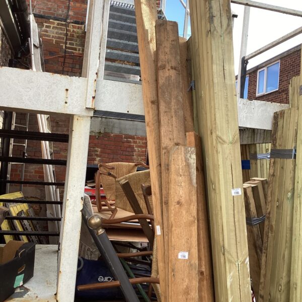 Stack of rough sawn timber planks for construction and DIY projects.