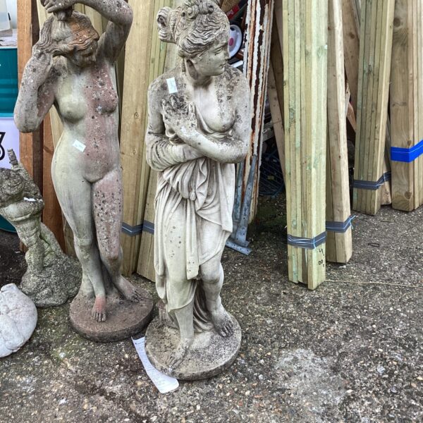 Detailed stone effect garden lady statue for outdoor decoration.