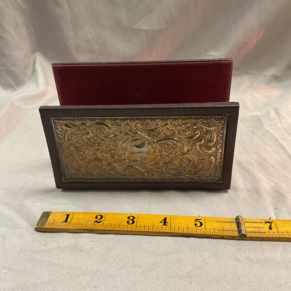 Antique Victorian silver mounted letter rack on a dark surface.