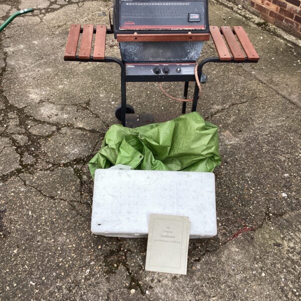 Vintage Sunbeam gas BBQ with cover, ideal for outdoor cooking.