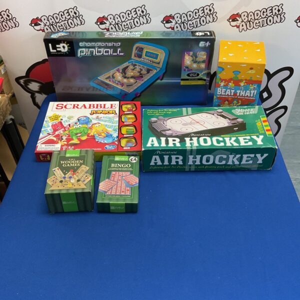 Mixed board games lot including pinball, air hockey and bingo.