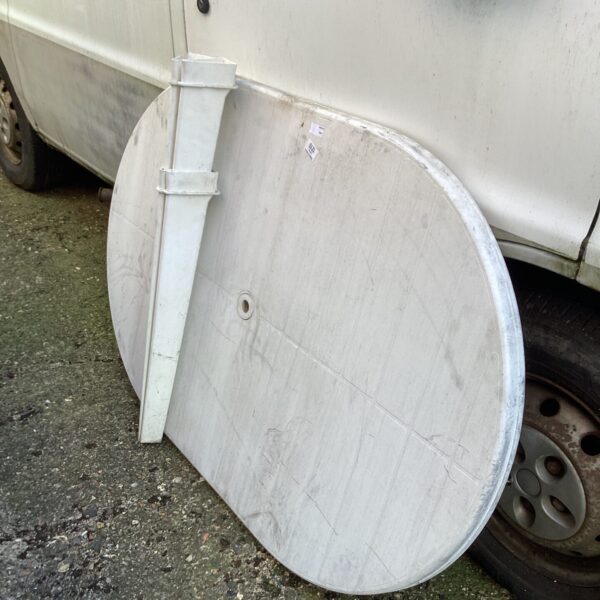 Large white plastic patio table for outdoor garden use.