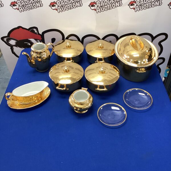 Royal Worcester gold effect cookware set on display.