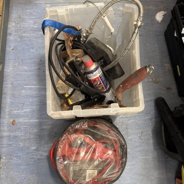 Shed clearance lot with jump leads, hammer, and spray can.