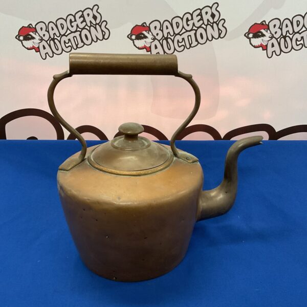 Large vintage copper kettle with patina, ideal for collectors.