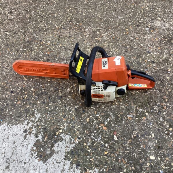 Vintage Stihl 021 chainsaw in used condition, forestry tool.