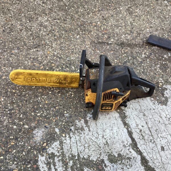 Vintage McCulloch chainsaw in used condition, a collectible power tool.
