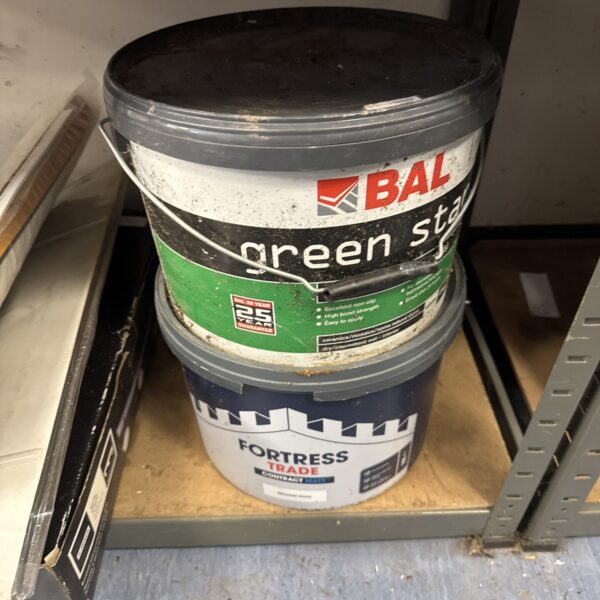 Large tub of white BAL tile adhesive and paint for DIY projects.
