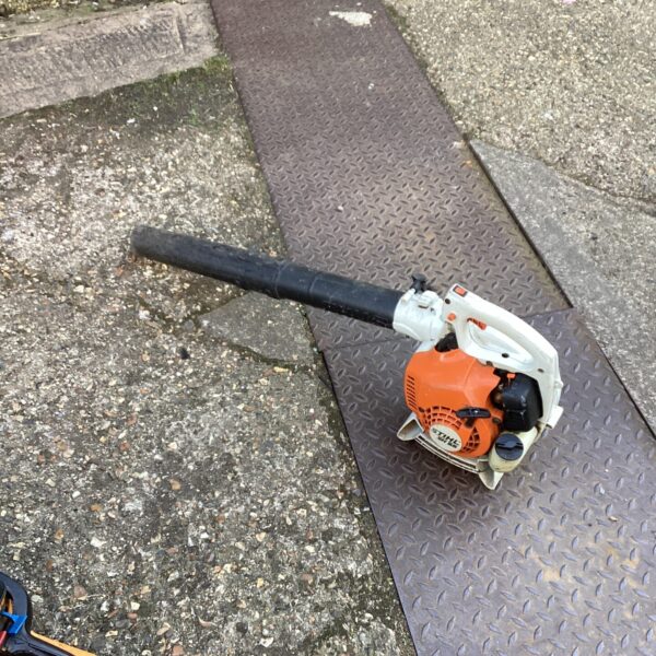 Stihl SH55 leaf blower on a patterned surface.