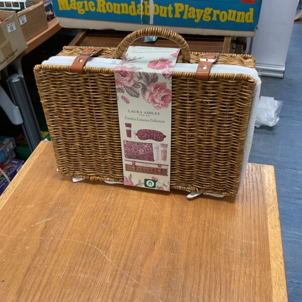 Vintage Laura Ashley Timeless Luxuries woven basket for storage.