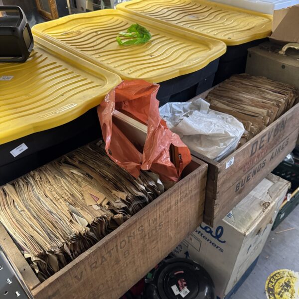 Overview of vintage photo and print lot with records.