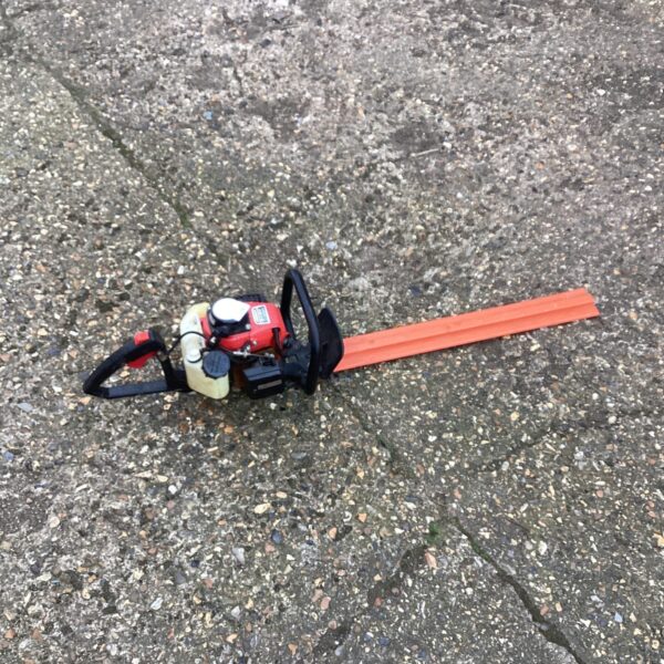Vintage Kawasaki TG18 hedge cutter for garden landscaping.