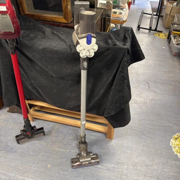Dyson DC44 cordless vacuum cleaner in grey, side view.
