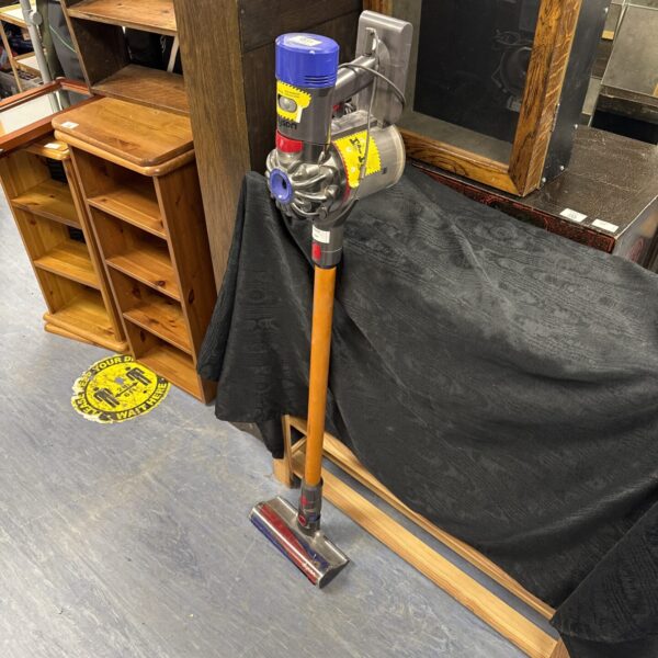 Dyson V8 Absolute cordless vacuum cleaner in a home setting.